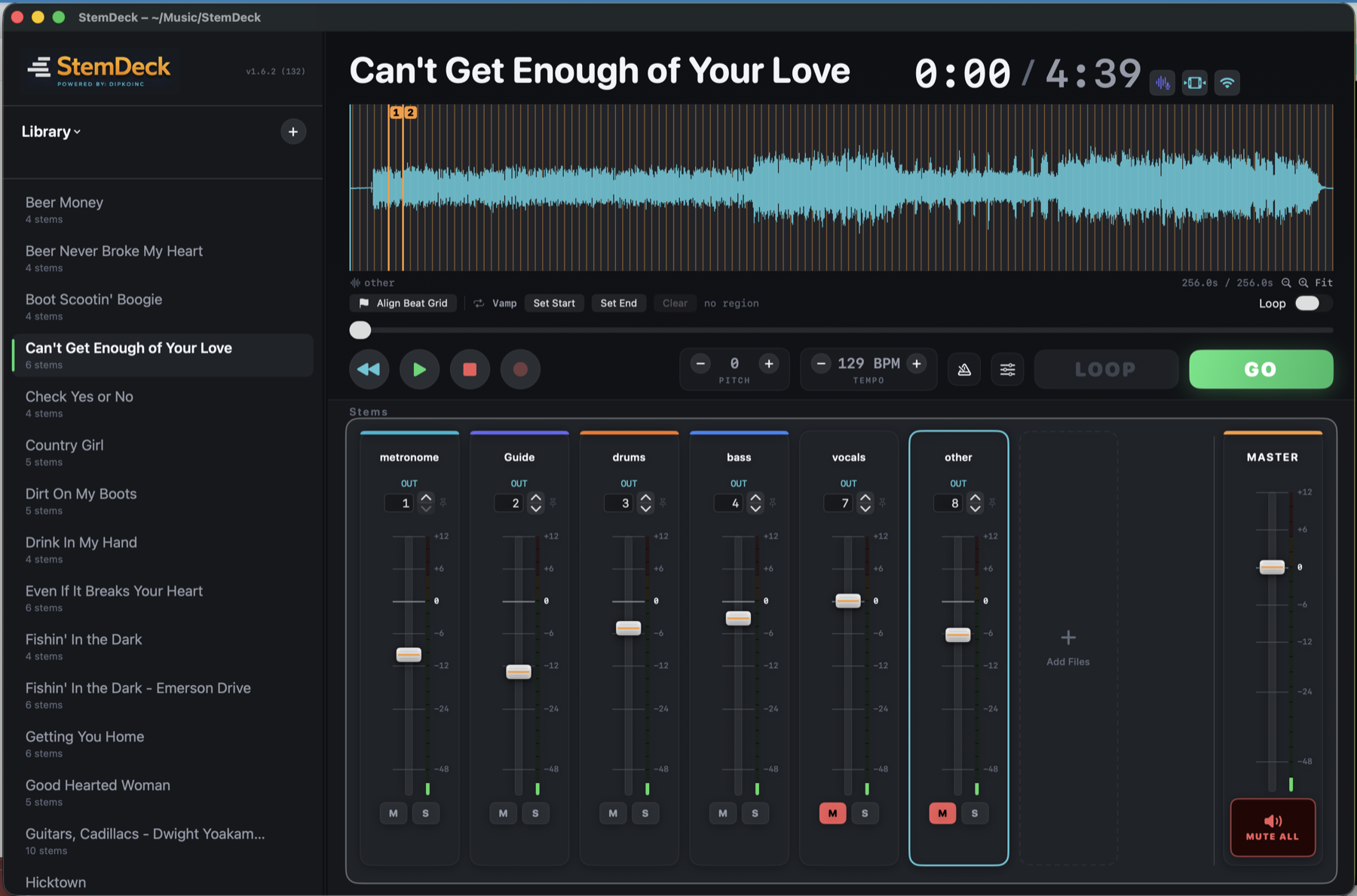 StemDeck running a live show: waveform, transport, and multi-channel stem mixer